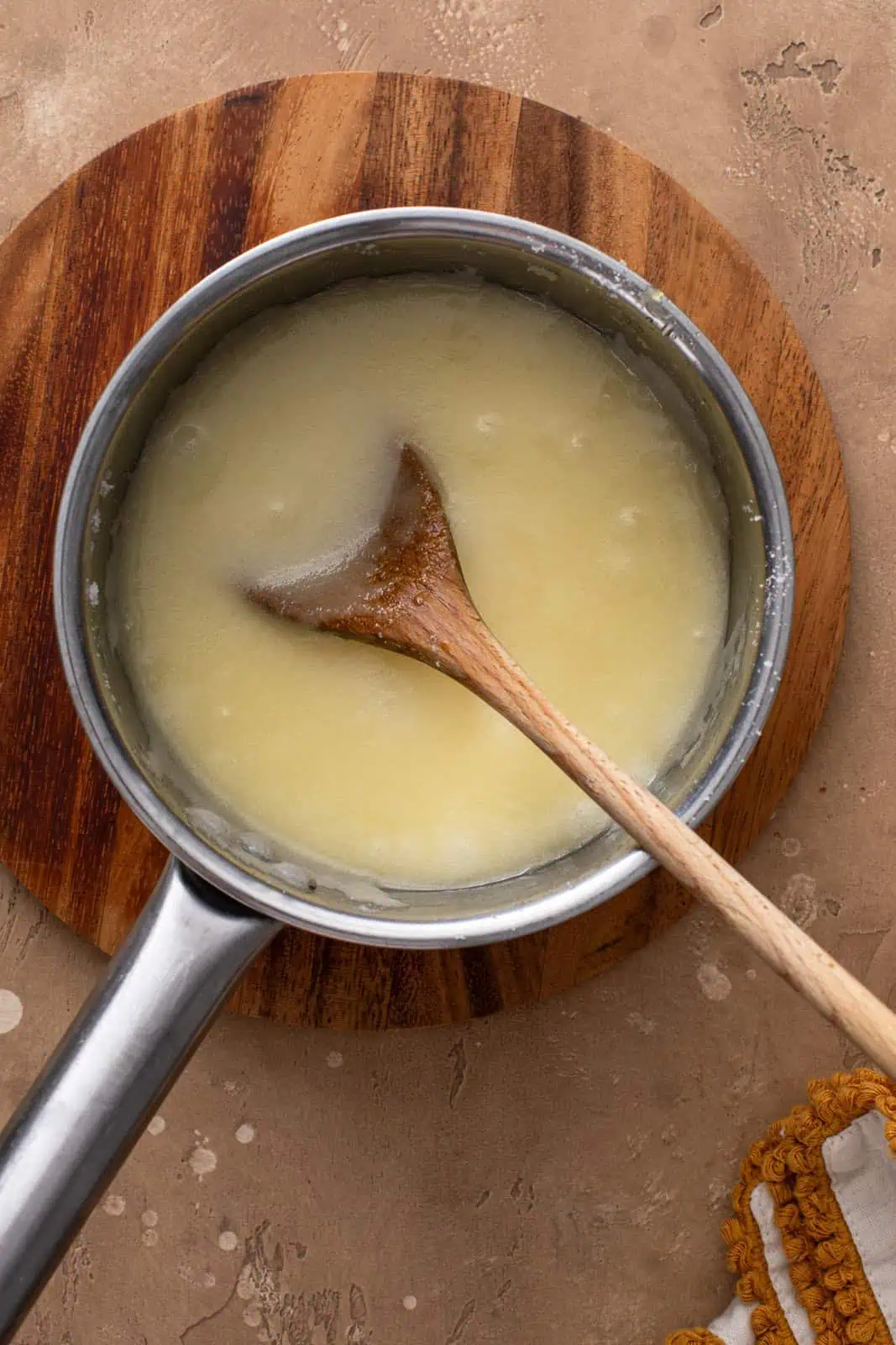 Butter and sugar cooked in a saucepan.