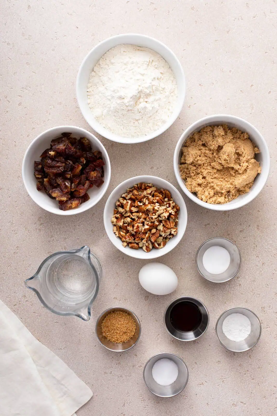 Ingredients for date nut bread arranged on a countertop.