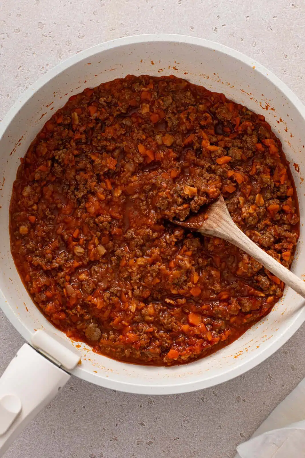 Thickened sloppy joe mixture in a skillet.