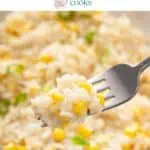 Fork holding up a bite of sweet corn risotto. Text overlay includes recipe name.