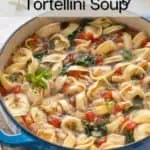 Cooked tortellini soup in a blue dutch oven. Text overlay includes recipe name.