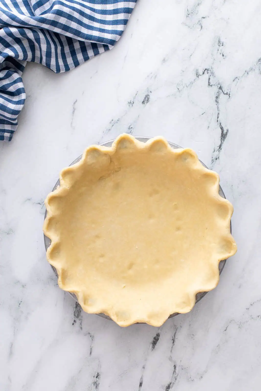 Pie crust in a deep dish pie plate.