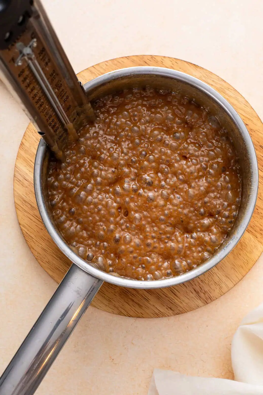 Brown sugar, butter, and half-and-half boiling in a saucepan.