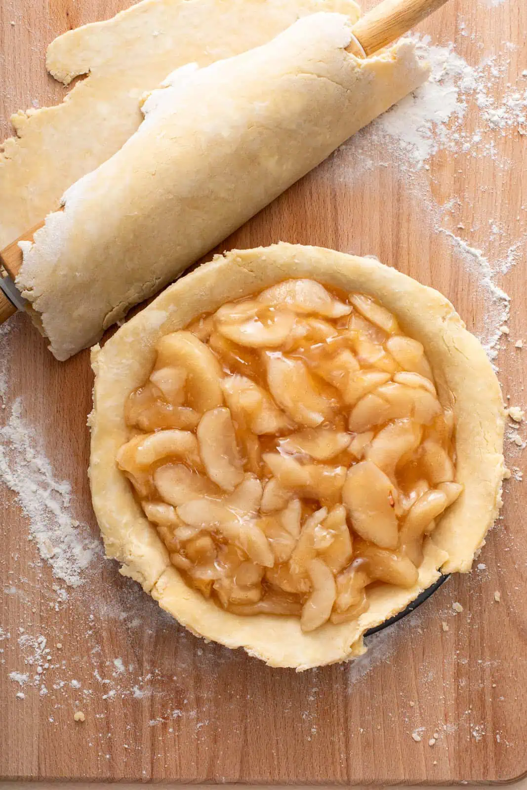 Apple pie filling in a pie plate.