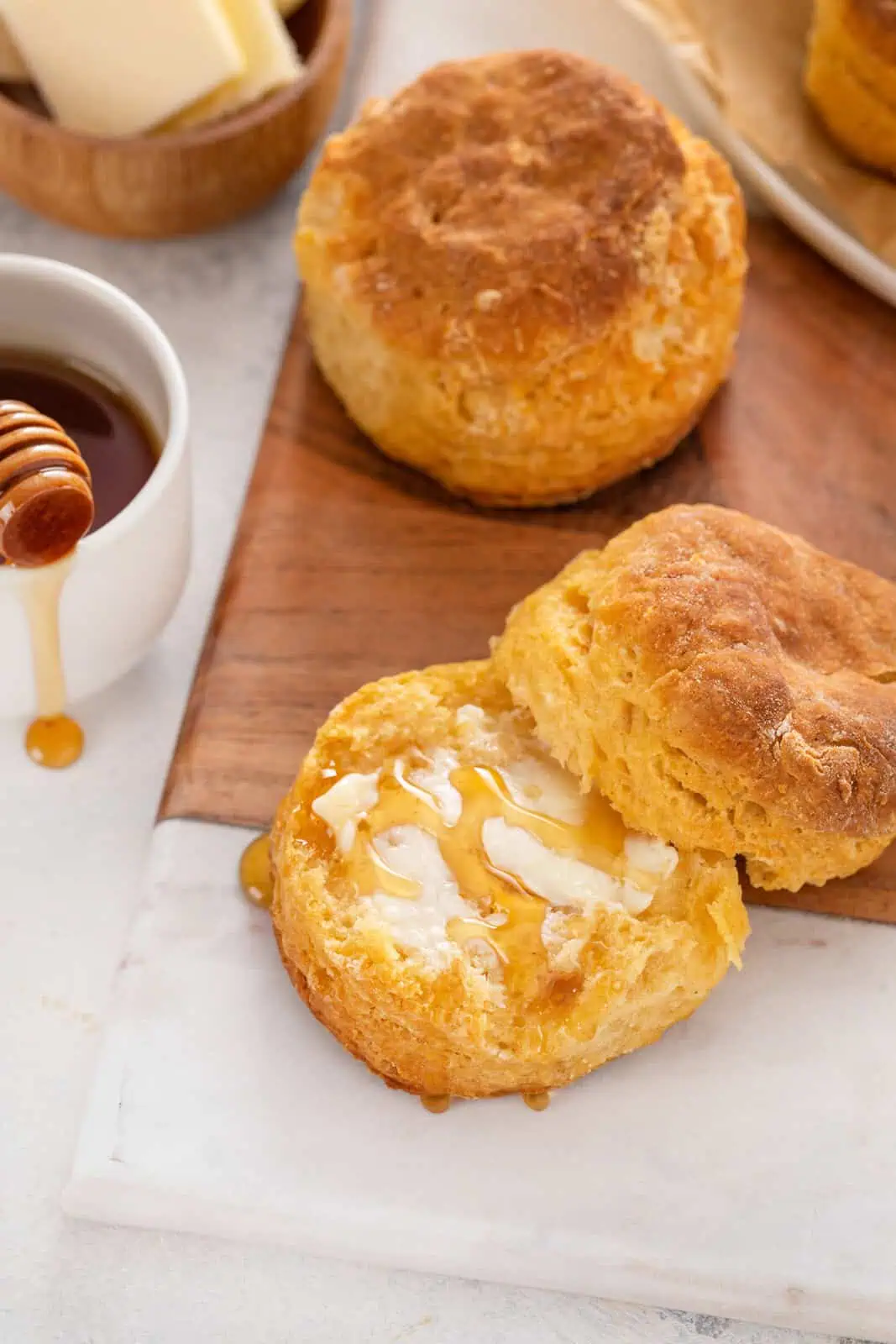 Sweet potato biscuit topped with butter and honey.