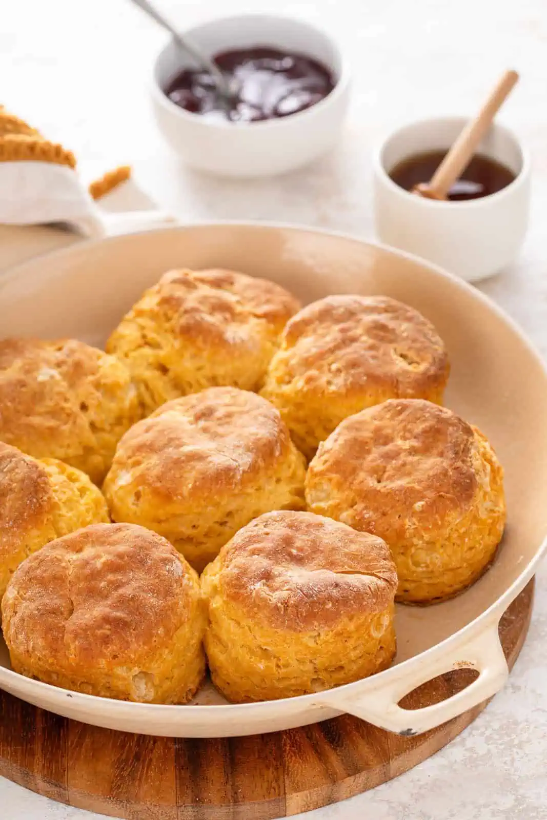 Eight baked sweet potato biscuits arranged in a skillet.