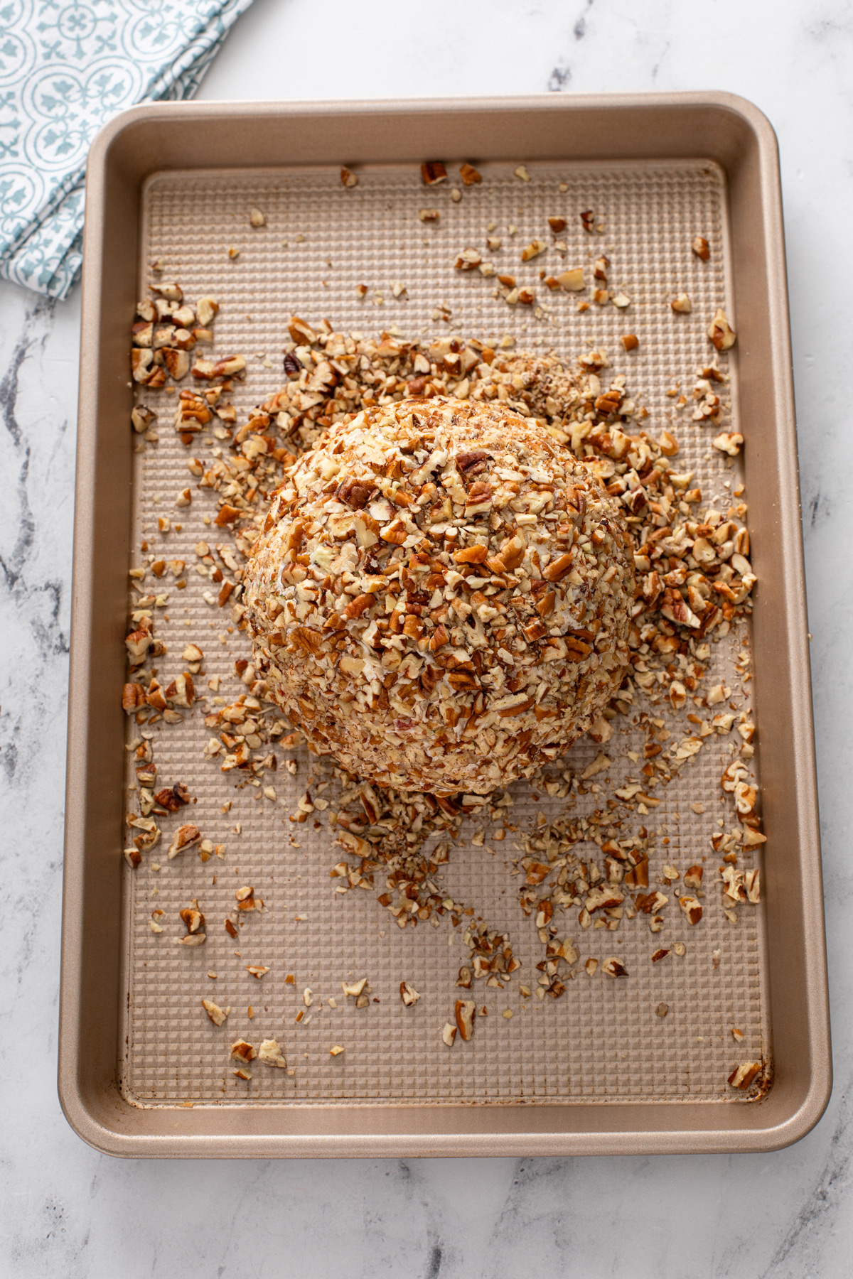 Pineapple cheese ball rolled in chopped pecans.