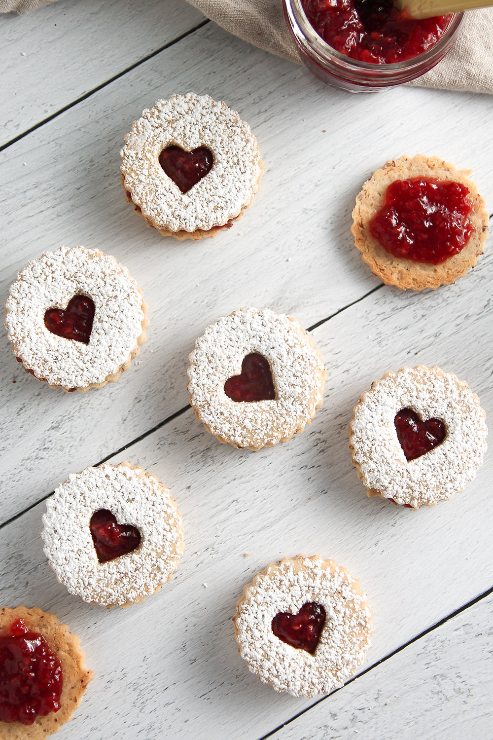 Tangy raspberry jam and nutty almonds come together to make sweet Raspberry Linzer Cookies.