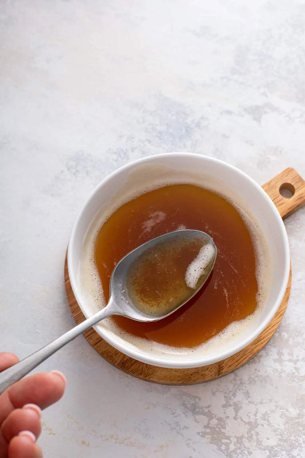 Spoon in a bowl of brown butter to show the nutty color.