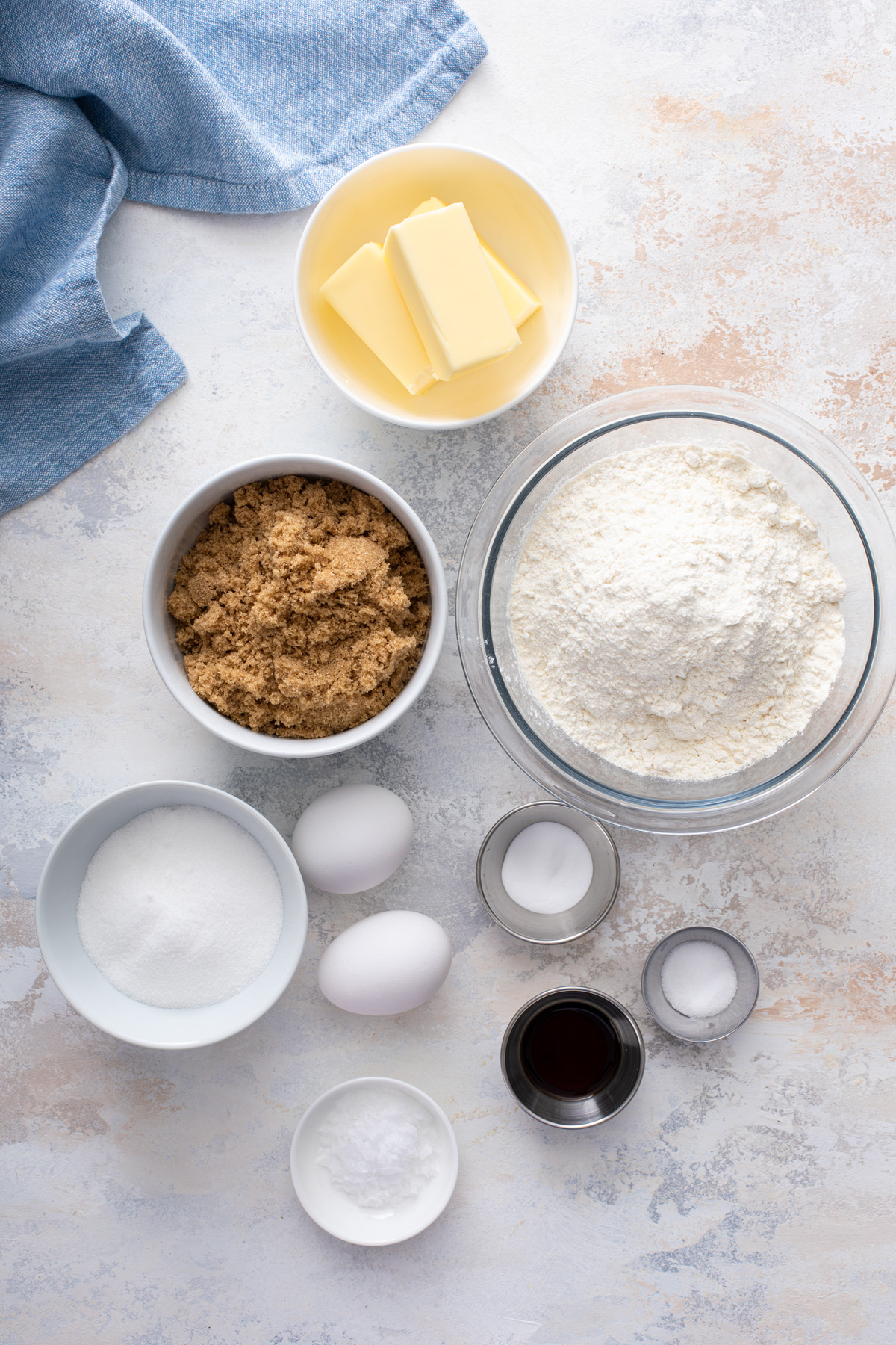 Ingredients for chocolate chipless cookies arranged on a countertop.