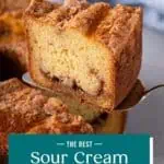 Cake server lifting up a slice of sour cream coffee cake. Text overlay includes recipe name.