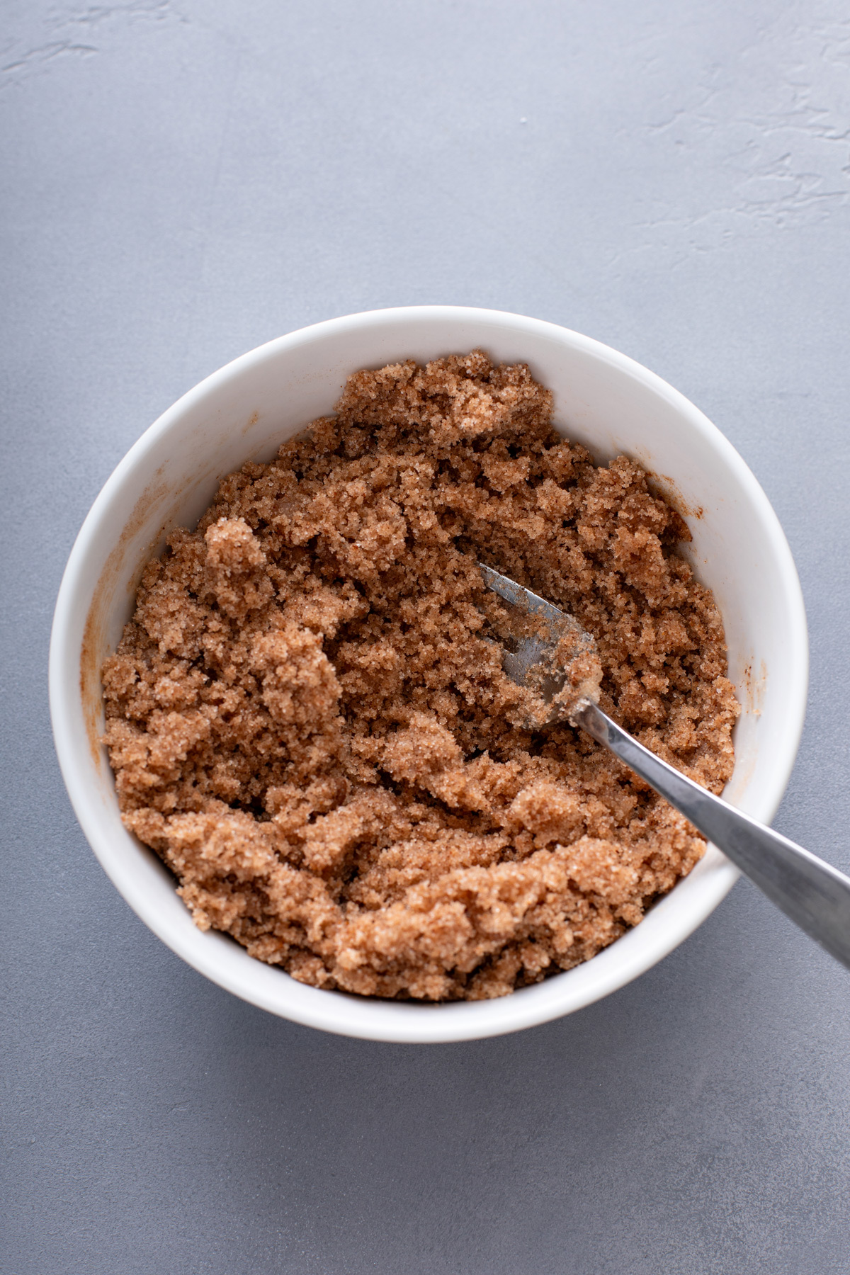 Cinnamon streusel topping mixed together in a white bowl.