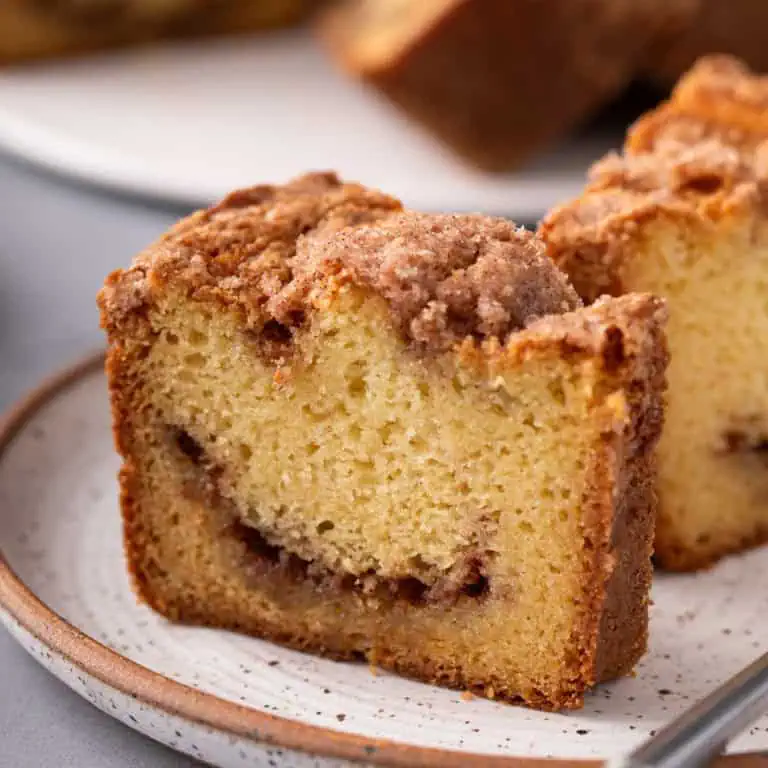 Close up of plated slice of sour cream coffee cake.