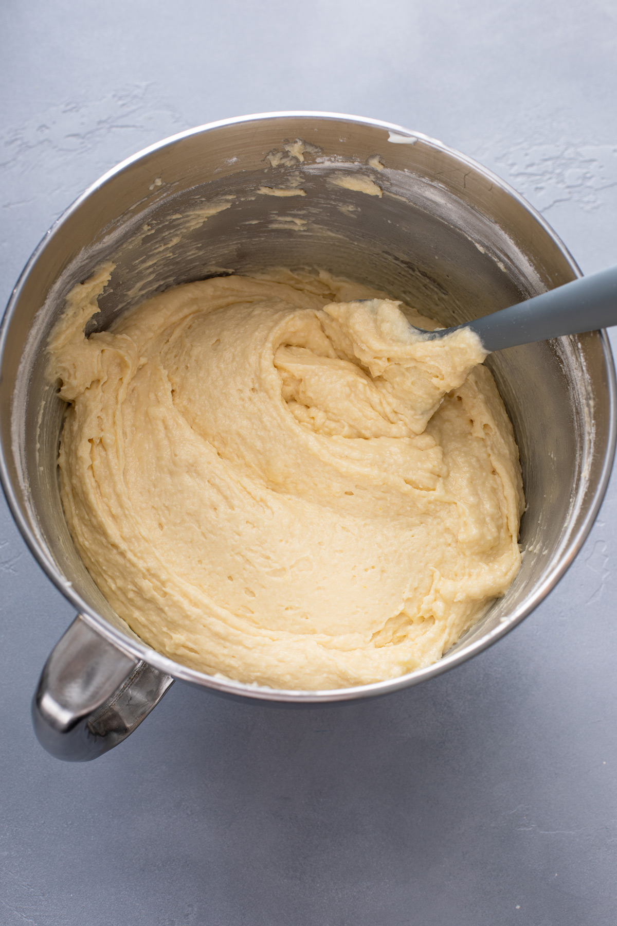 Sour cream coffee cake batter mixed together in a metal bowl.