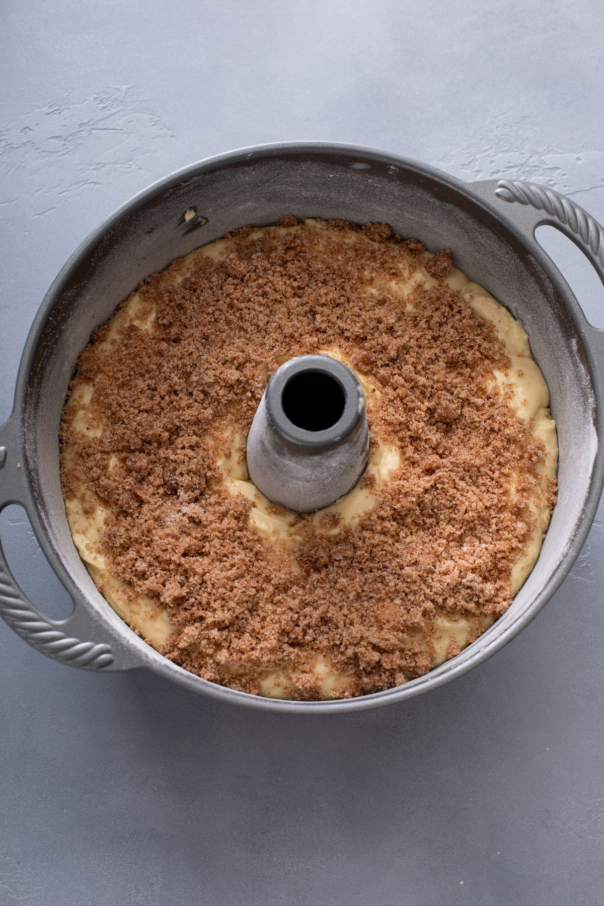 Sour cream coffee cake assembled in a tube pan, ready to go in the oven.